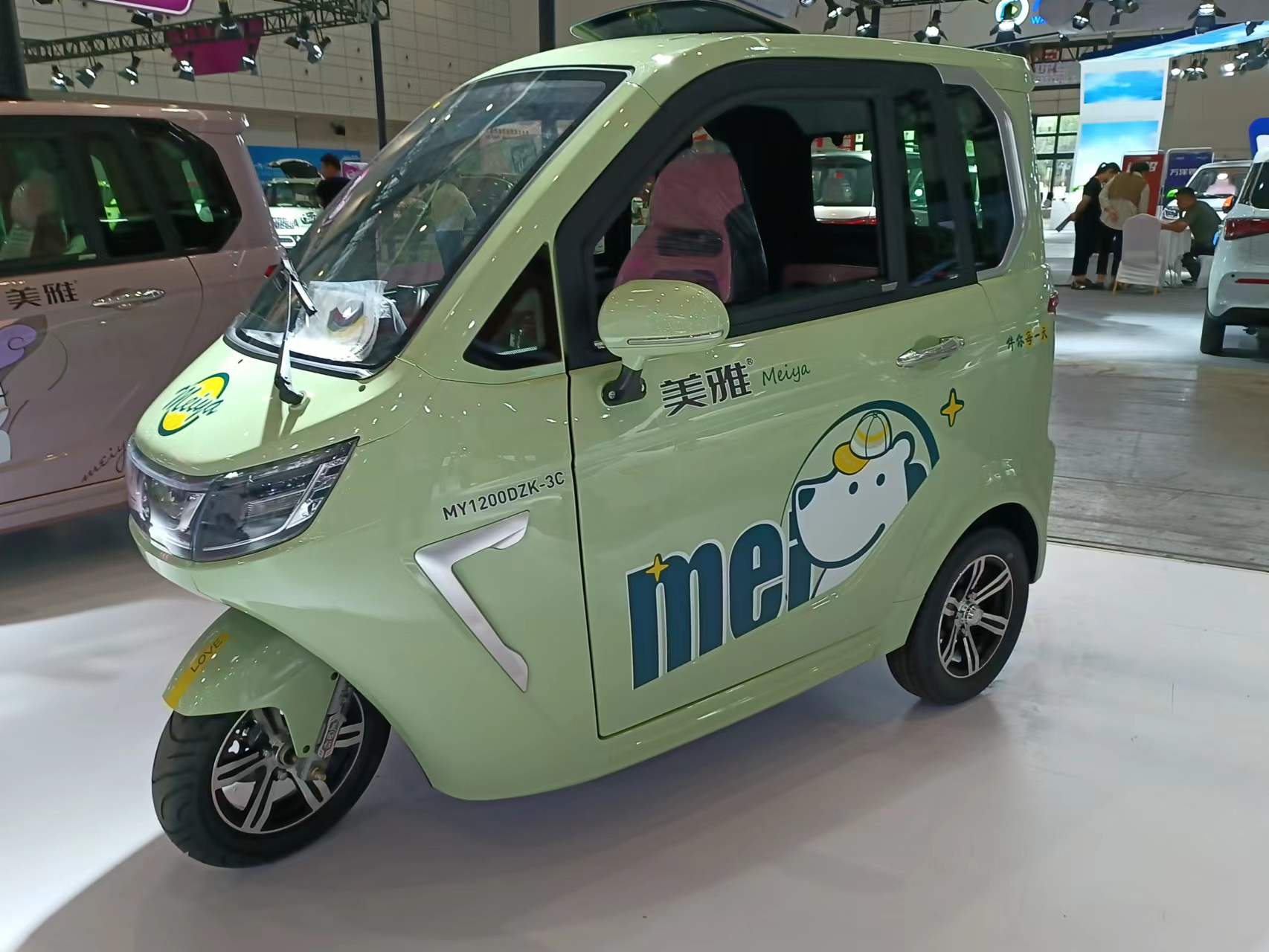 The new three-wheel fully enclosed electric vehicle carries three people