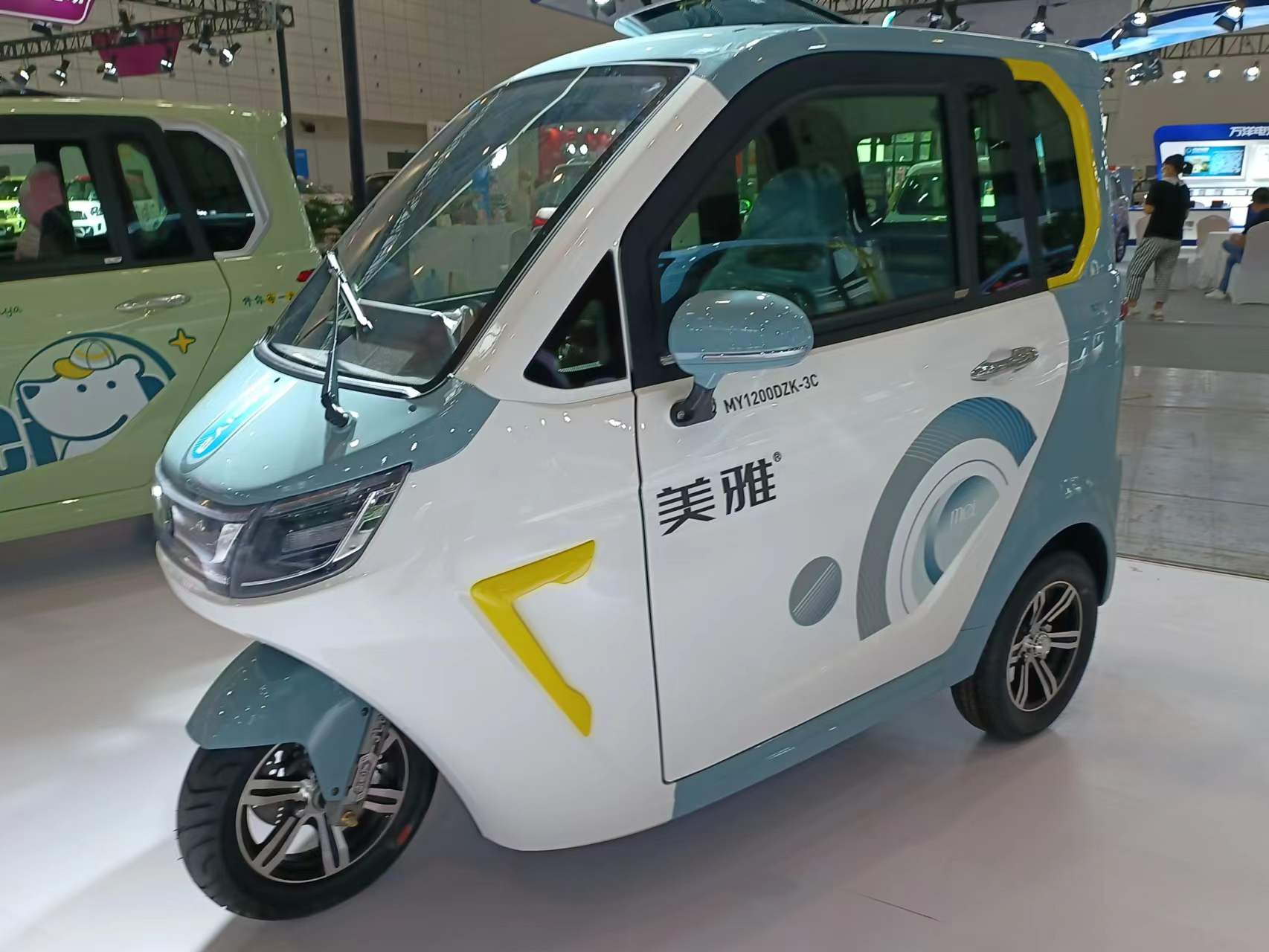 The new three-wheel fully enclosed electric vehicle carries three people