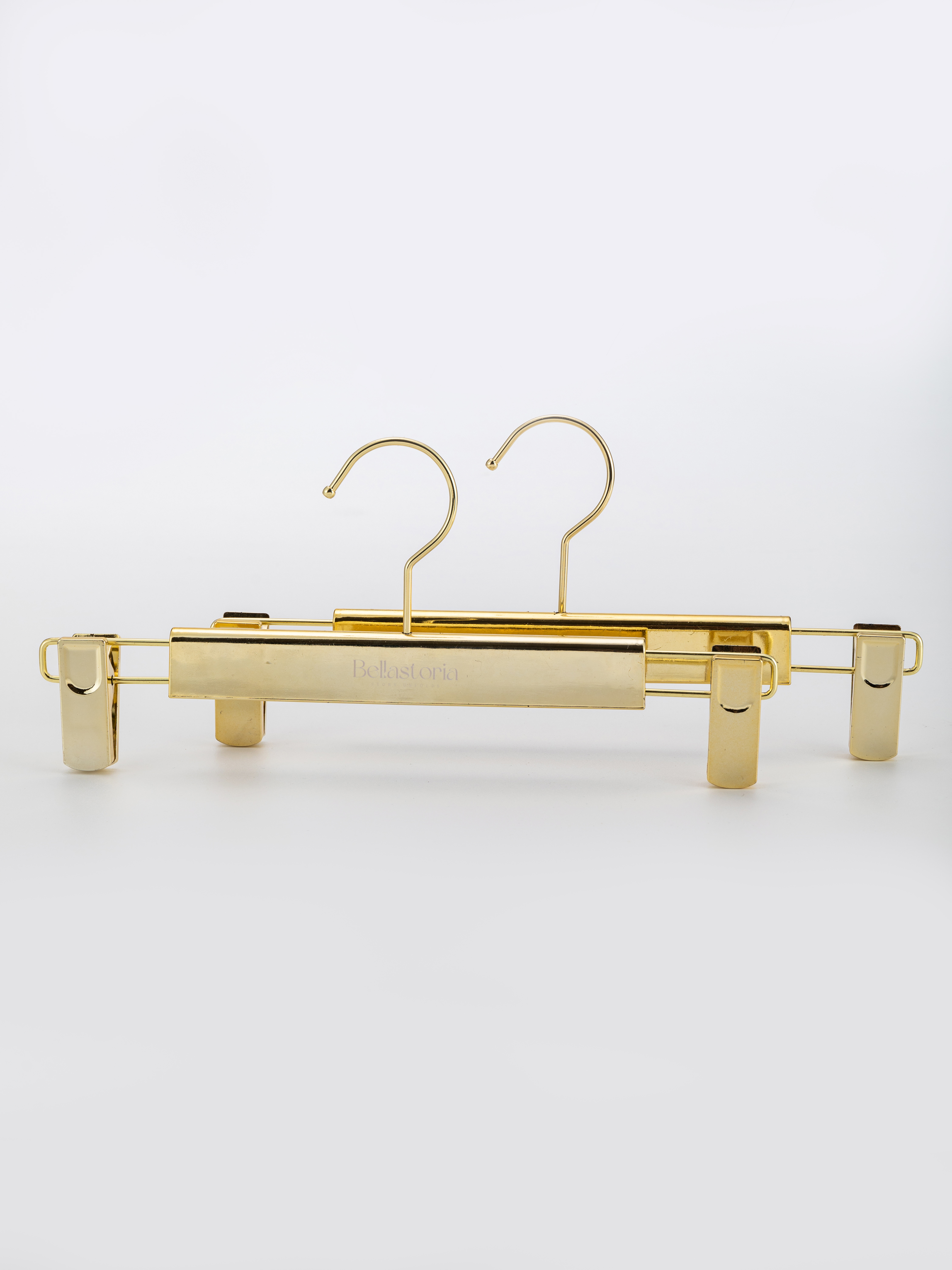 Percha de metal dorado de primera calidad con pinzas