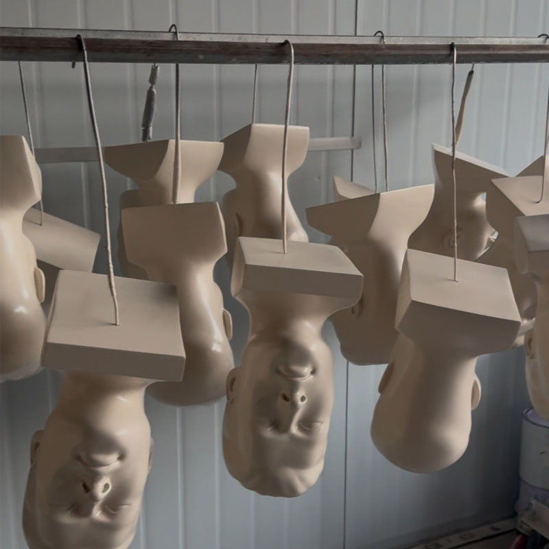 A semi-finished dummy head model that is being dried