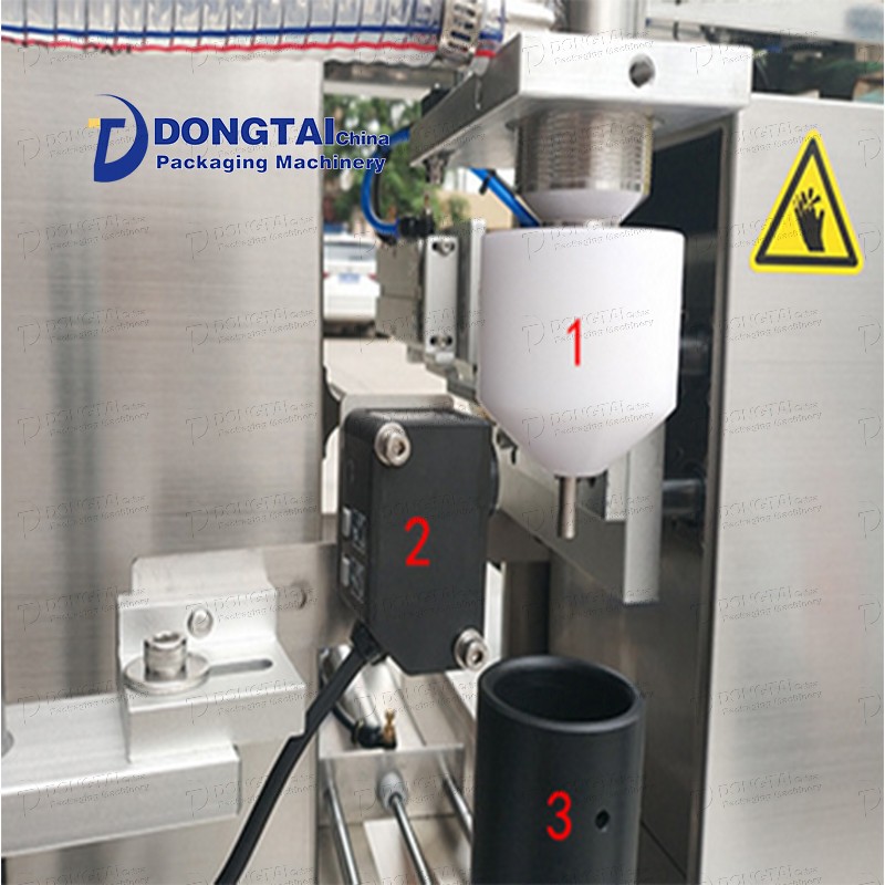 Vertical toothpaste tube filling and sealing machine