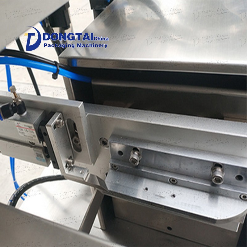 Vertical toothpaste tube filling and sealing machine