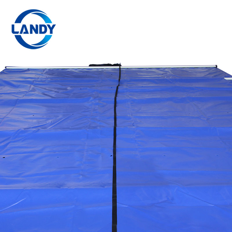 Solid pool cover with drain panel