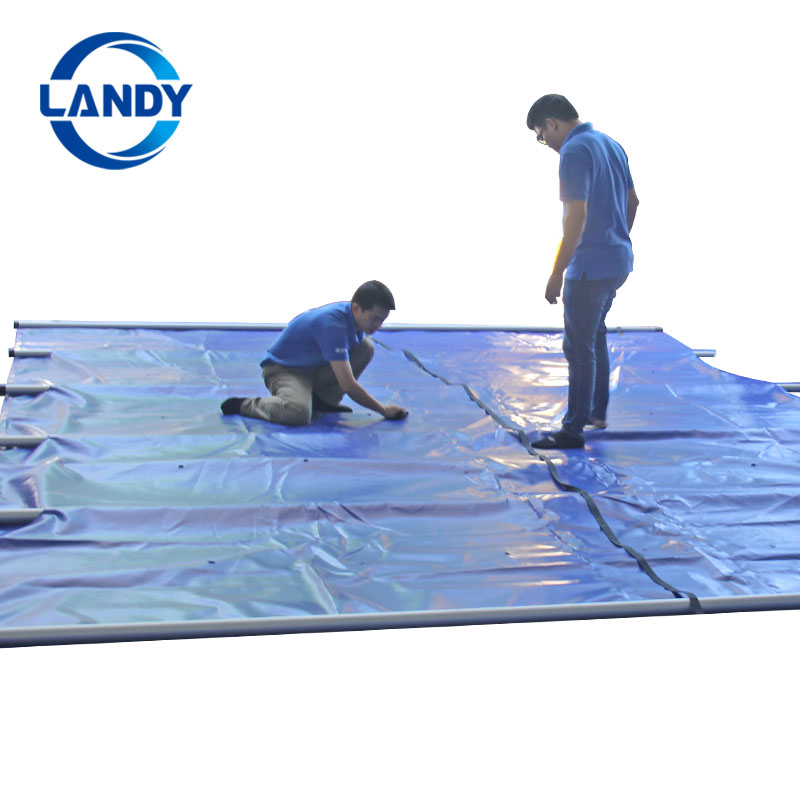 Solid pool cover with drain panel