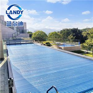 Exklusiver Vertrieb UV-Schutz Blaue transparente automatische Schwimmbadabdeckungen