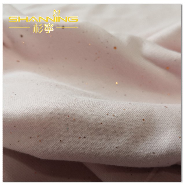 Tecido jersey 95% algodão 5% elastano com estampa dourada