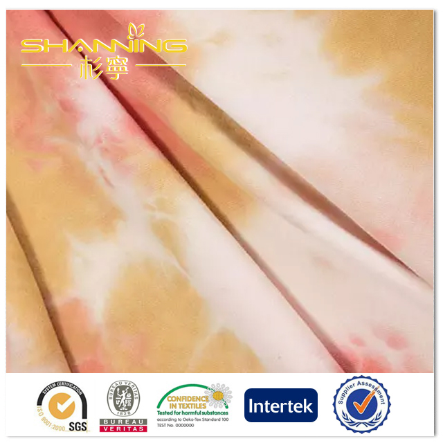 Китай Полиэстер Эластан Галстук-краситель Одиночная ткань Джерси с односторонней отделкой персикового цвета, производитель