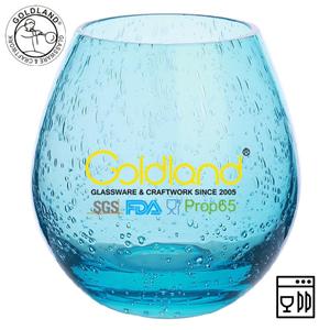 Vaso de vidrio de color azul hecho a mano con burbujas de aire