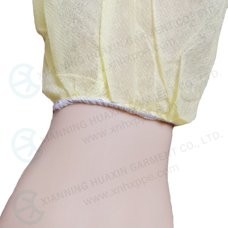 Non-woven yellow PP isolation gowns with hood and elastic cuff Factory