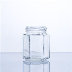 Barattolo di miele esagonale in vetro alimentare