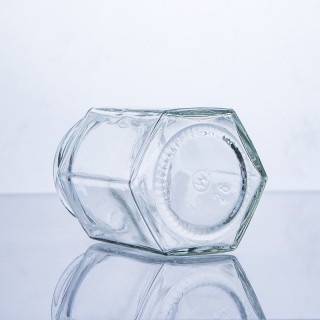 Barattolo di miele esagonale in vetro alimentare