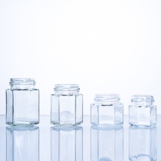 Barattolo di miele esagonale in vetro alimentare