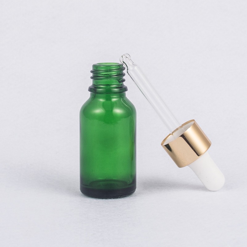 Grüne Kosmetik-Glasflasche mit Pipette