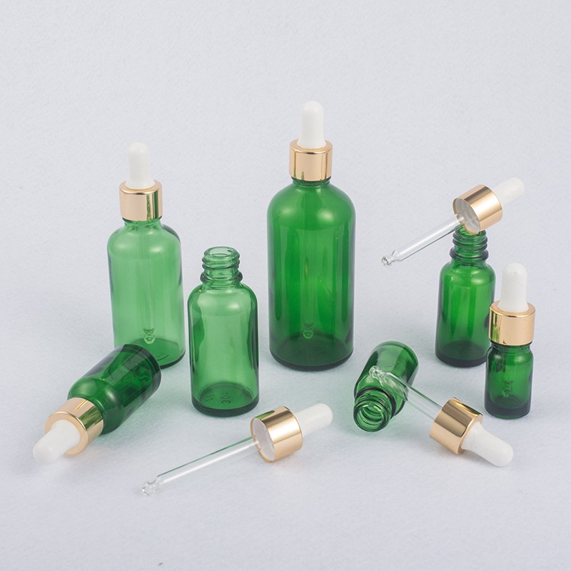 Grüne Kosmetik-Glasflasche mit Pipette