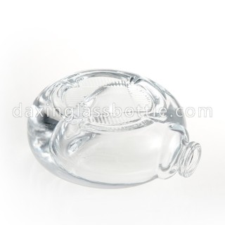 Botella de perfume vacía de forma redonda plana de vidrio de alta calidad con bomba de pulverización