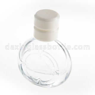 Botella de perfume vacía de forma redonda plana de vidrio de alta calidad con bomba de pulverización