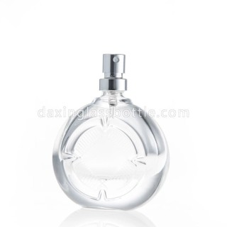 Botella de perfume vacía de forma redonda plana de vidrio de alta calidad con bomba de pulverización