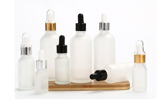 Botella de aceite esencial y botella de loción