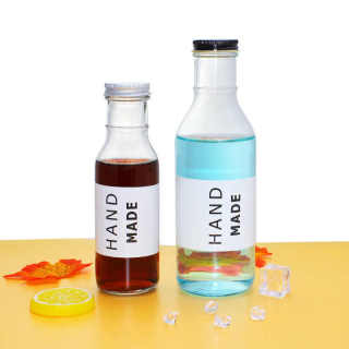 Bottiglia di bevanda in vetro Boston rotonda francese pressata a freddo all'ingrosso da 8 oz, 12 oz e 16 oz con coperchio in plastica