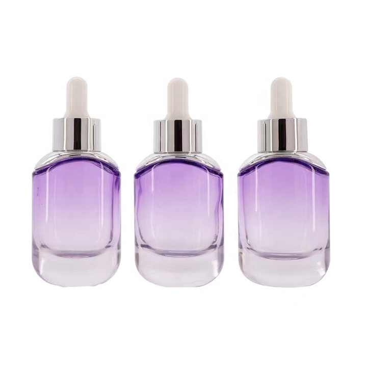 Fournisseurs d'emballages cosmétiques en gros de 30 ml Flacon compte-gouttes en verre pour huile essentielle avec épaulement argenté