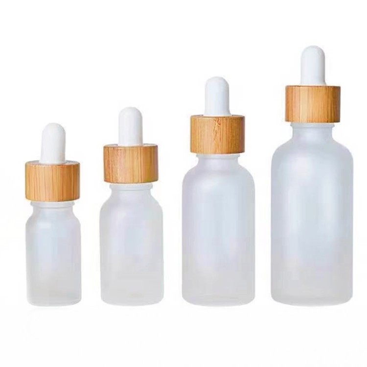 Flacon compte-gouttes en verre dépoli avec bouchon en bambou de 0,5 oz et 1 oz pour emballage d'huile essentielle de soins de la peau