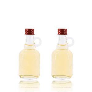 Prezzo di fabbrica 50 ml bottiglie di vetro vuote trasparenti piccole mini California con manico per sciroppo d'acero