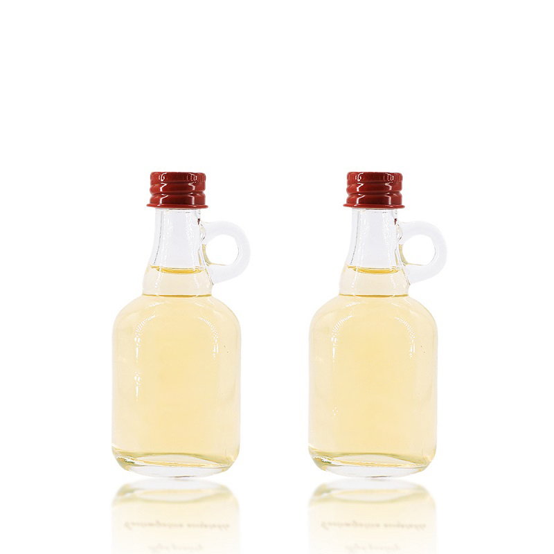 Harga Pabrik Botol Kaca Mini Kecil Bening Kosong 50ml dengan Pegangan untuk Sirup Maple