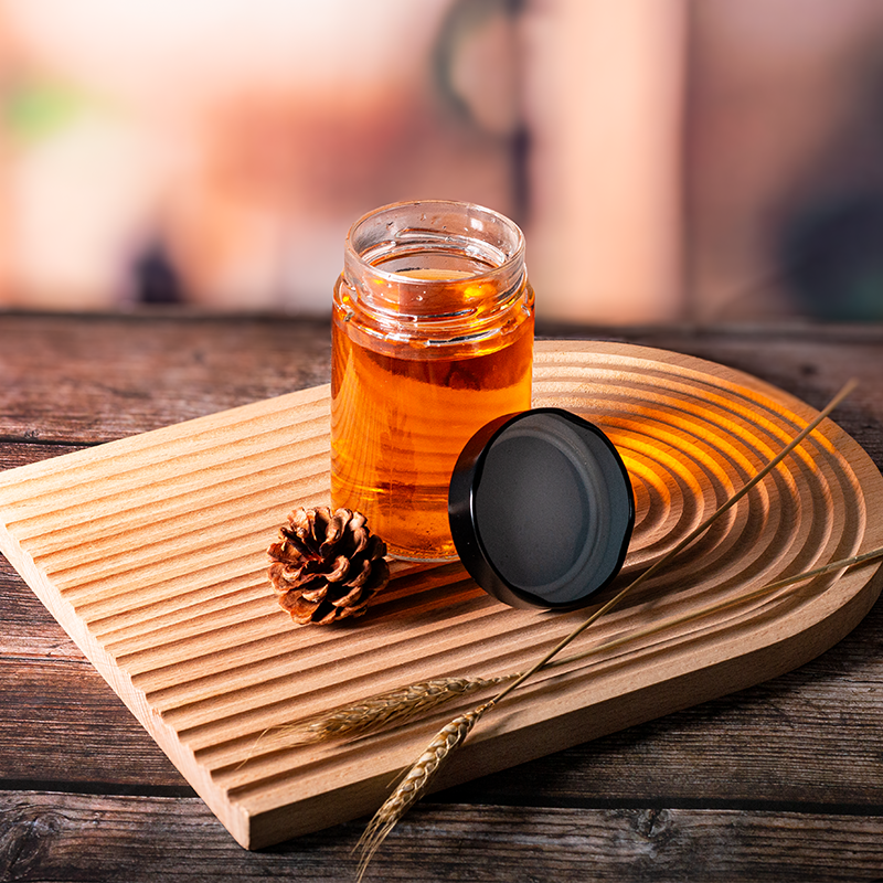Glass food jar with aluminum cap