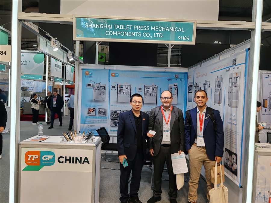 Global partnership discussion at CPHI Milan Shanghai Tablet Press with pharmaceutical industry visitors
