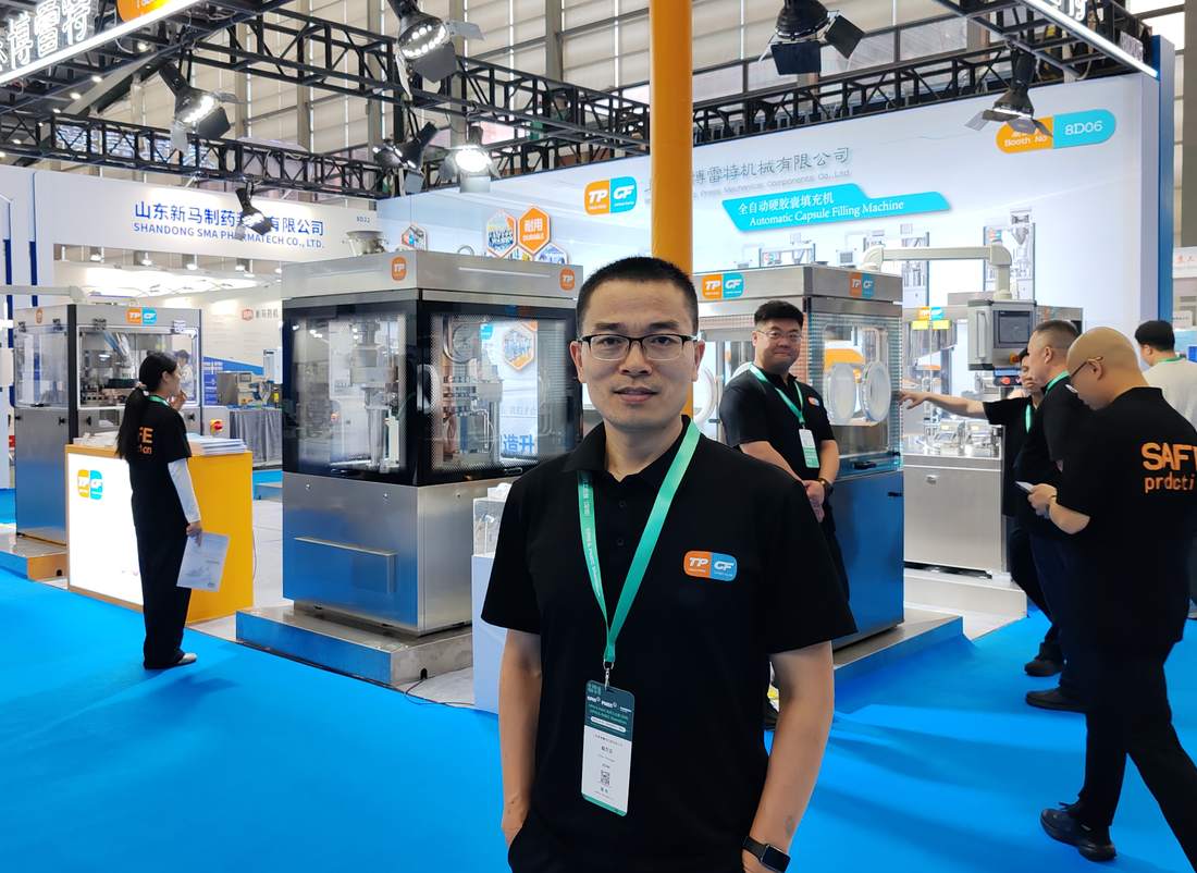 Shanghai Tablet Press representative at Booth 8D06 in Shenzhen
