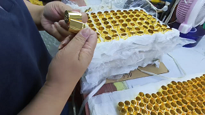 inspect perfume caps one by one