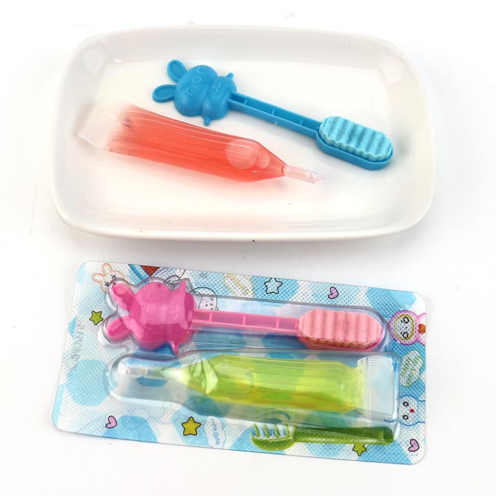 Cartoon toothbrush shaped pressed tablet candy with fruit flavored liquid jam CH-Z268