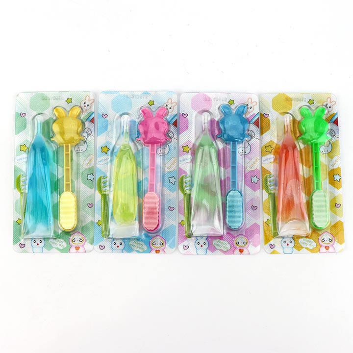 Cartoon toothbrush shaped pressed tablet candy with fruit flavored liquid jam CH-Z268