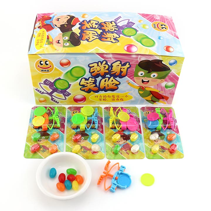 Finger ejection smiling face expression flying saucer toy candy wiht jelly bean candy CH-T1280