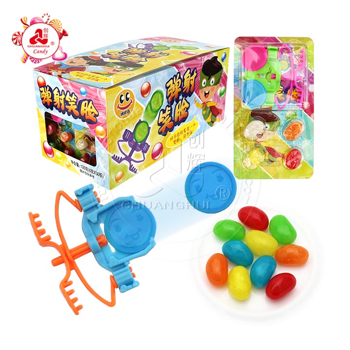 Finger ejection smiling face expression flying saucer toy candy wiht jelly bean candy CH-T1280