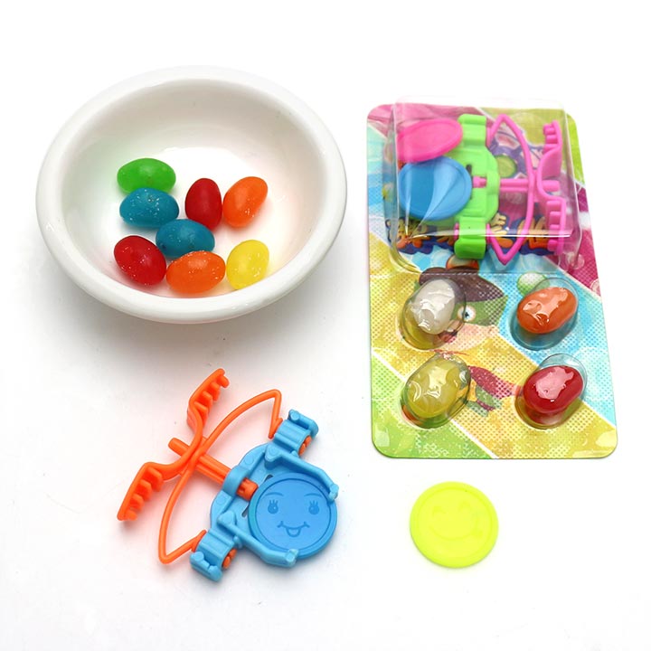 Finger ejection smiling face expression flying saucer toy candy wiht jelly bean candy CH-T1280