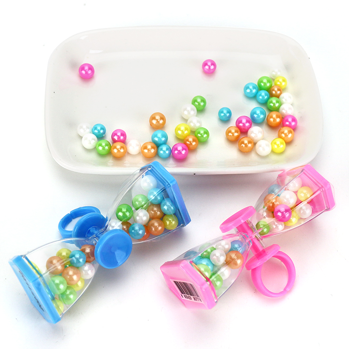 Time hourglass shaped finger spinning top toy with colored bead hard candy CH-T1447
