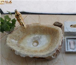 Lavabo Honey Onxy avec nature à l'extérieur