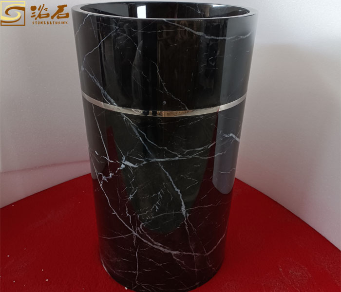 Black White Marble Pedestal Sink With Golden Steal Ring Around Sink