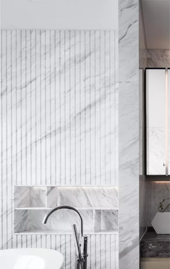 Can you give an example of how to cleverly combine stone with other materials to increase visual depth?