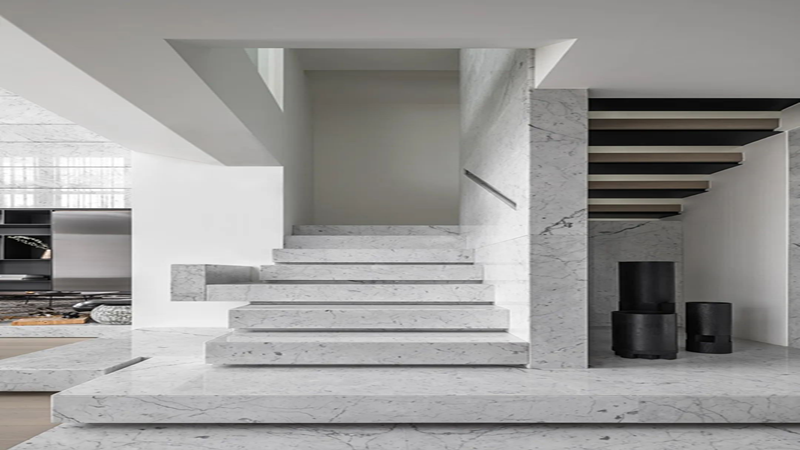 A modern space, decorated with Carrara white marble for quiet harmony.