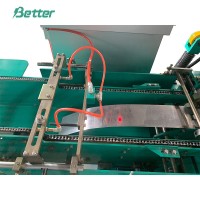 鉛蓄電池両面貼り付け機