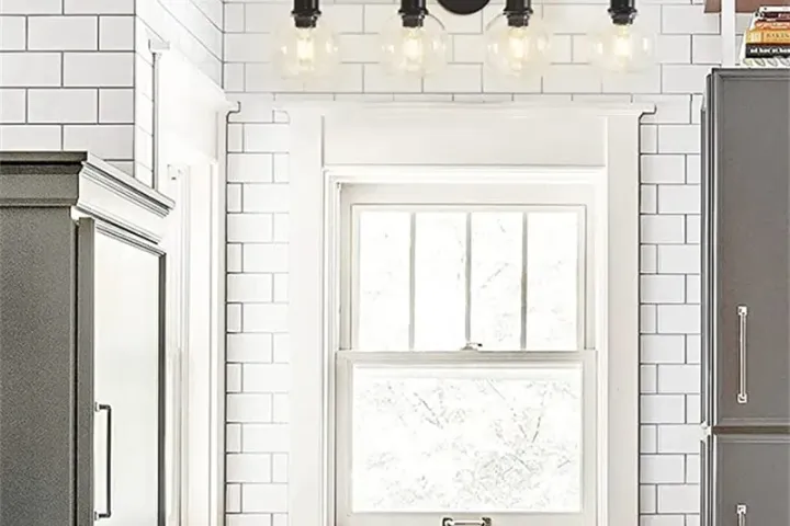 Can bathroom vanity light fixtures be hung above a mirror?