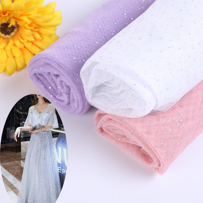 Tissu de maille tricoté par chaîne de brillance populaire tissu de robe de mariée peigné d'or saupoudré de tissu de paillettes de broderie de maille d'étincelle