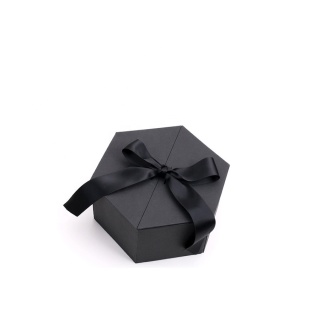 Caixa de presente hexagonal de fita vermelha