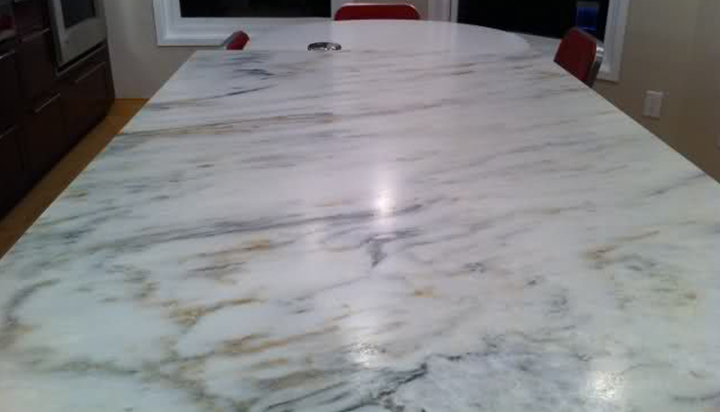 What is the difference between Marble look quartz stone and marble?