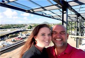 Customer from Aruba was happily installing the building he bought from us with his family