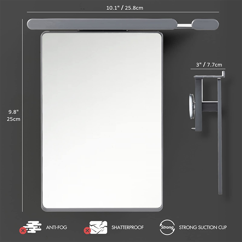 Fogless shower mirror with razor holder