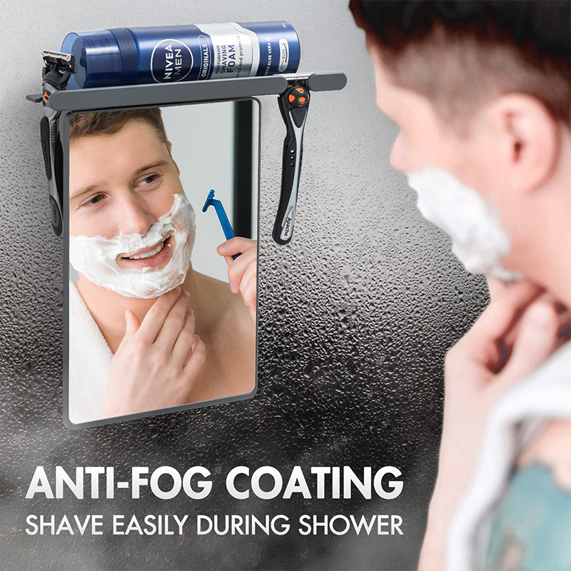 Fogless shower mirror with razor holder