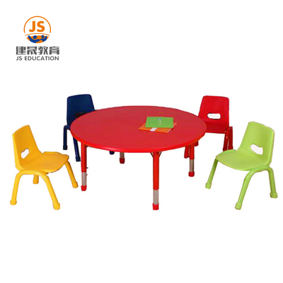 Mesa de jardín de infantes redonda y colorida con almacenamiento
